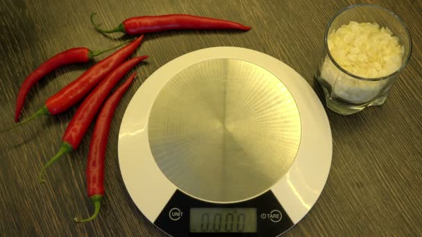 Weigh parsley on kitchen electronic scales — Stock Video