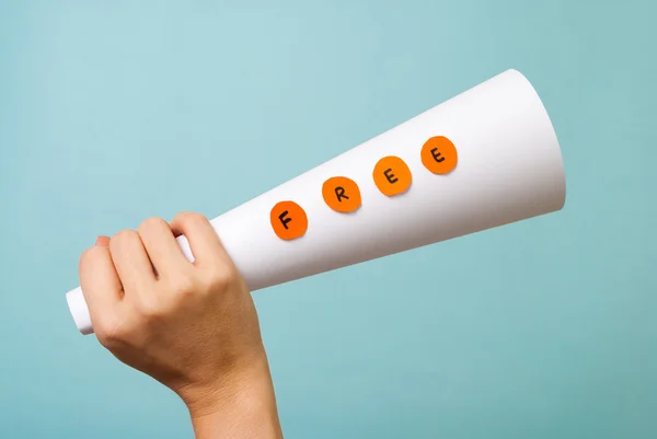 Free words on megaphone. Hand holding free message. — Stock Photo, Image