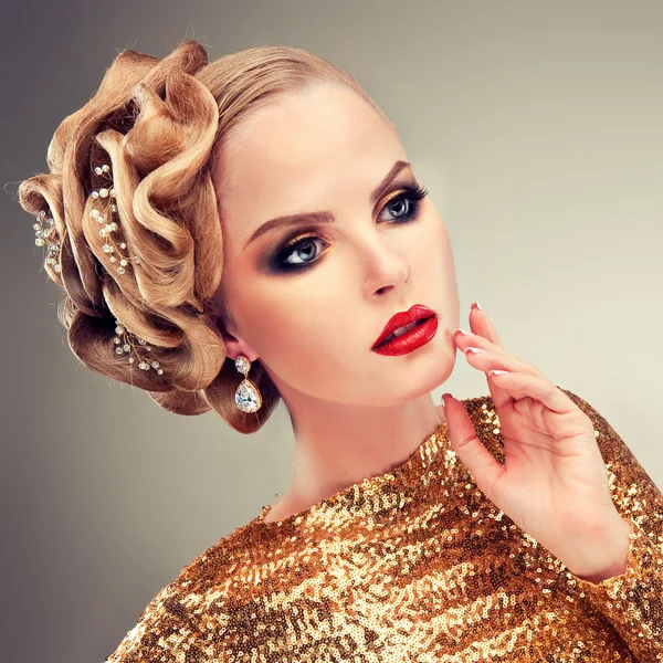 Blond woman in golden dress — Stock Photo, Image