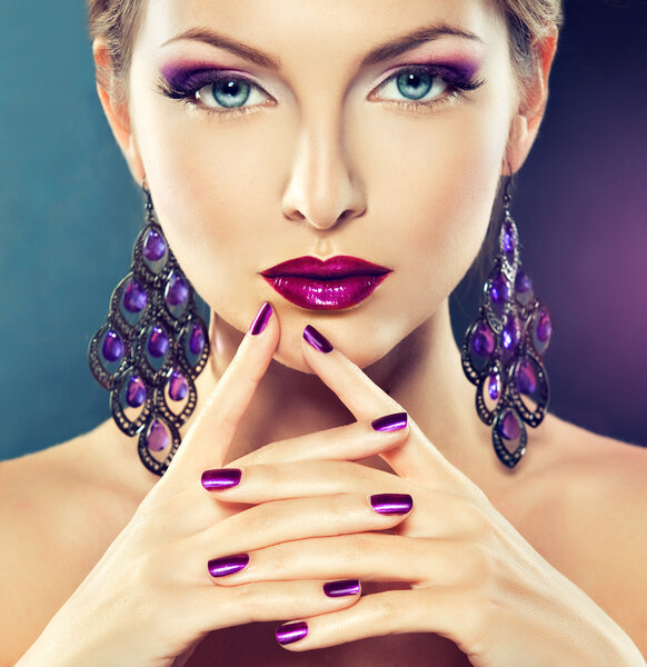 Beautiful girl with purple manicure nails