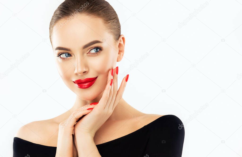 Beautiful woman showing red lips and manicure nails .model girl . Evening bright makeup . Beauty , make-up and cosmetic