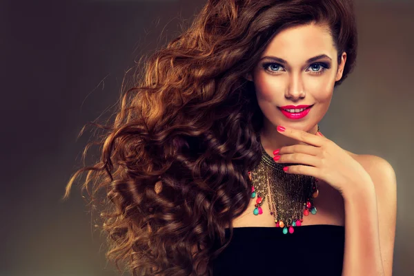 Girl with long curly hair — Stock Photo, Image