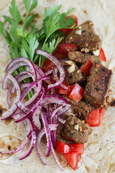 liver in flatbread with tomatoes