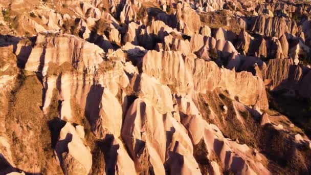 Famous Pink Valley At Sunset, Red and Pink Rocks, Dramatic geological wonder. Gulludere in Cappadocia, Turkey. Colourful Mountains, Birds eye view 4k aerial drone landscape. — Stock Video