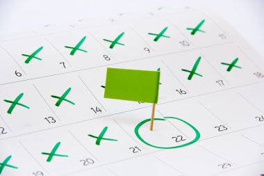Pin the event day on calendar with flag clipart