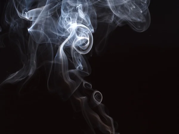Abstrakter Rauch auf schwarzem Hintergrund Stockbild
