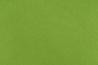 Açık yeşil keçeli kumaş arka plan - yumuşak kumaş yüzeyinin yakın çekimi. Kusursuz arkaplan, grafik tasarımı, yapıştırma kitabı, tekstil düzeni, yaratıcı projeler.
