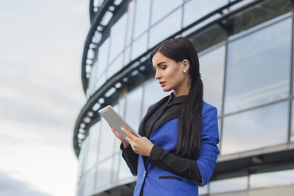 businesswoman using a digital tablet