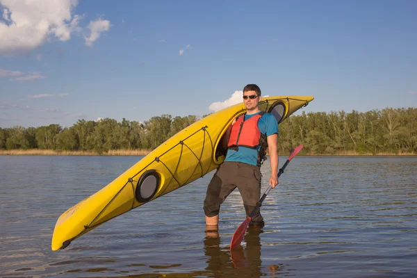 Men travel by canoe on the river in the summer a sunny day. — Stock Photo, Image