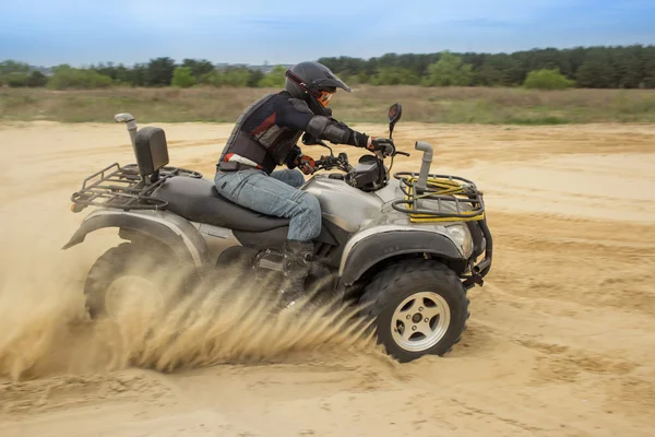 Racing ATV in the sand — Stock Photo, Image