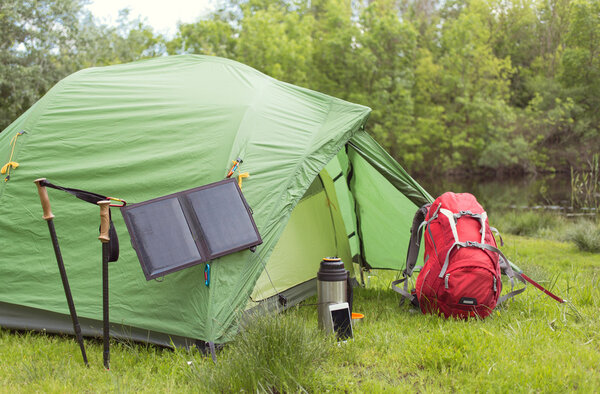 Camping in the woods on the banks of the river.