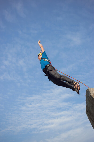 Jump off the cliff with a rope.