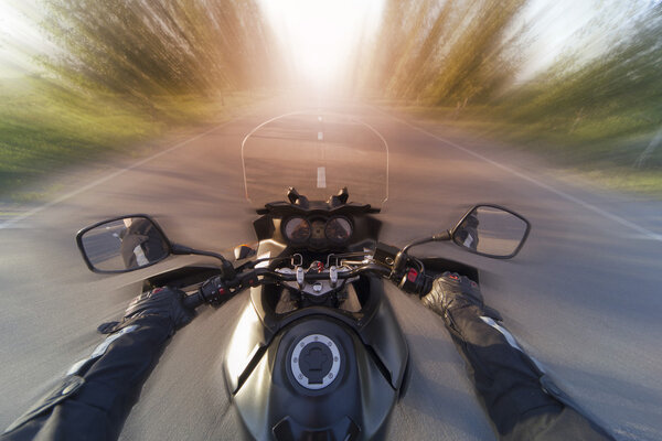 Traveling on a motorcycle on the mountain roads.