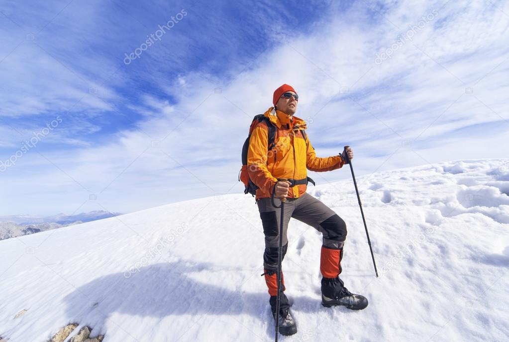 Winter hiking in the mountains with a backpack.