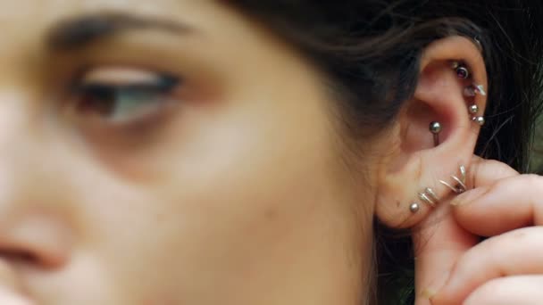 Cute Girl Playing Ear Piercing Footage — Stock Video