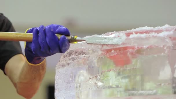 Ice Carver Using Chisel to Carve — Stock Video