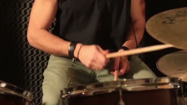 Active drummer playing at drums set in a studio — Stock Video