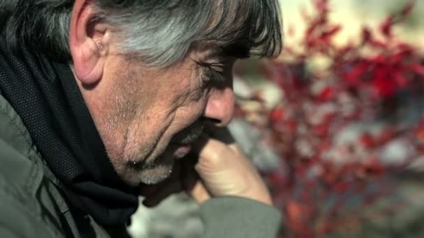 Close up of a mature man portrait lost in thought — Stock Video