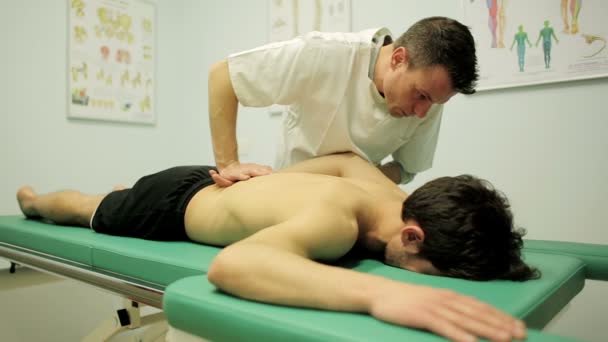 Checking Shoulder Pain Young Man Lying Visiting Table — Wideo stockowe