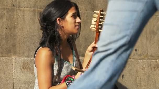 Young woman playing old string instrument the gusle — Stock video