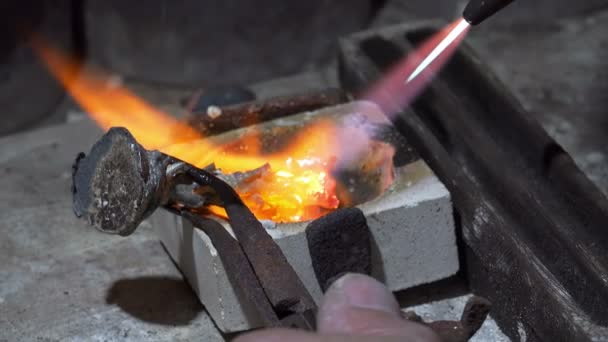 Goldsmith melting a silver piece — Stock Video