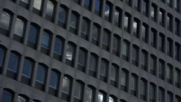 Clouds moving over the windows of the building — Stock Video