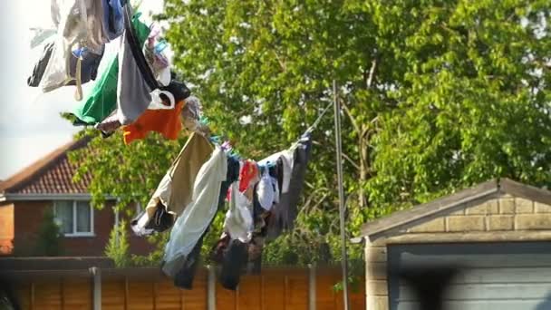 Clothes hanging in the sun — Stock Video