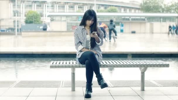 Asian woman using smartphone — Stock Video