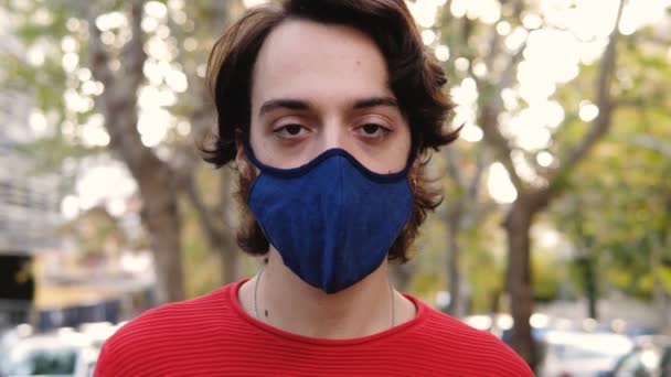 Serious Pensive Man Wearing Mask Stares Camera Steady Cam — Stock Video