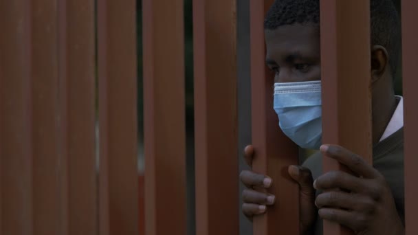 Symbol Lack Freedom Black Man Wearing Mask Bars Gate — Stock Video