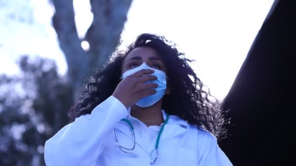 Young Hispanic Doctor Pulls Her Mask Breathes Sigh Relief — Stok Video