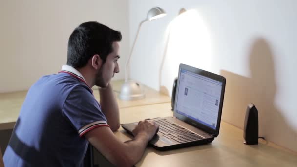 Man working at the laptop  and surfing in internet — Stock Video