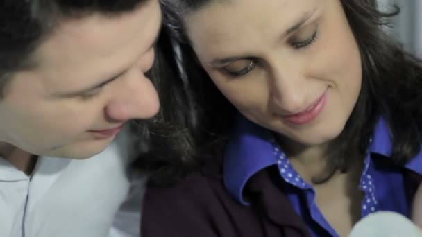 Couple sitting with baby girl — Stock Video