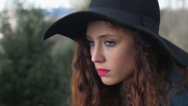 Beautiful sad and depressed woman with hat — Stock video