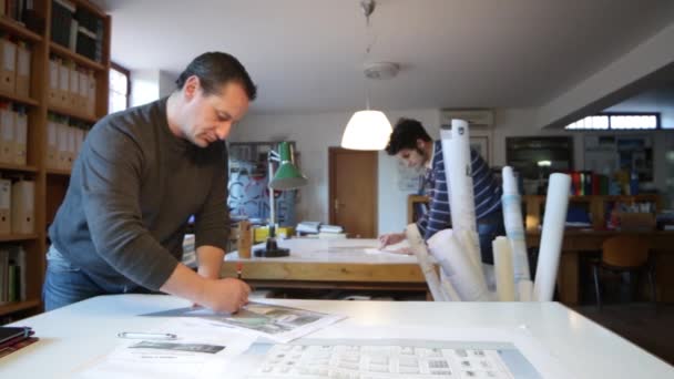 Two architects  sketching plans — Stockvideo