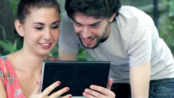 Man and woman using webcam on tablet — Stock Video