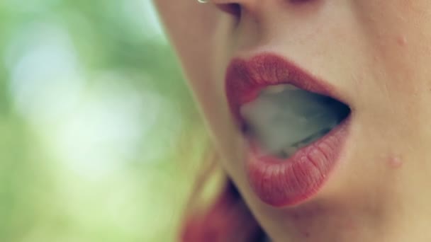 Young woman smoking a joint — Stock Video