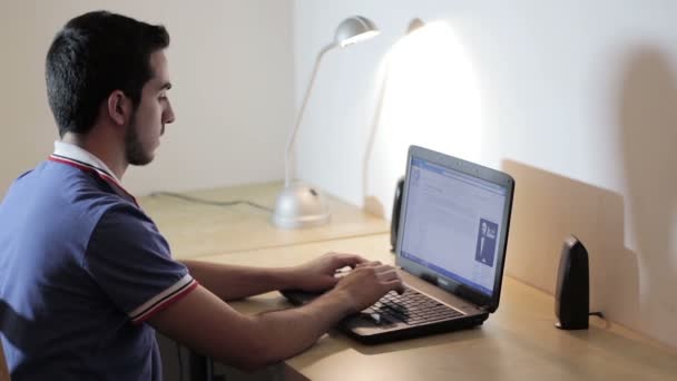 Man working at the laptop  and surfing in internet — Stock Video