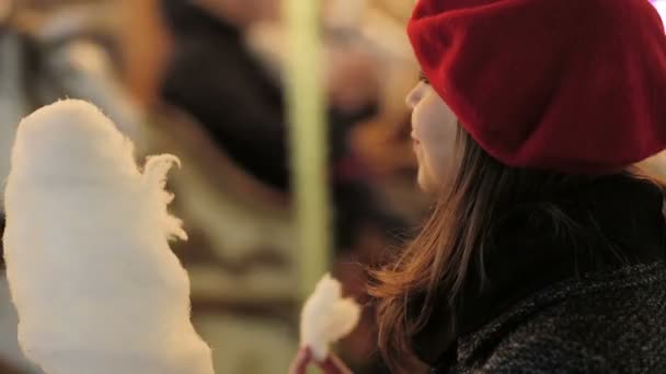 Woman eats cotton candy — Stock Video