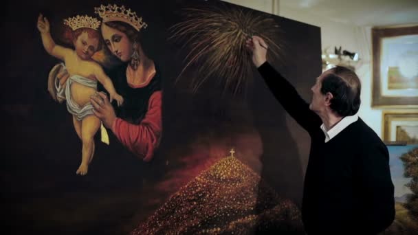 Painter finishes his religious picture — Stock Video