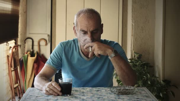 Depressed sad man drinking red wine and smoking cigarette: sadness, thoughtful — Stock Video