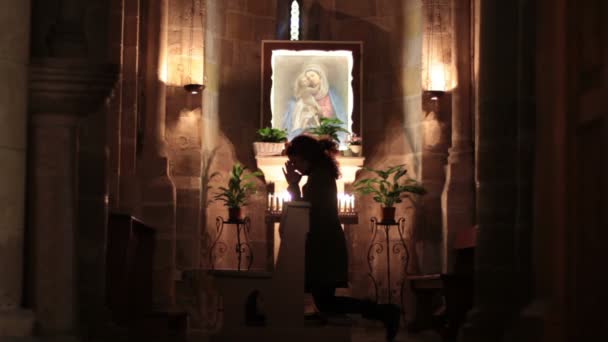 Woman praying in church — Stock Video