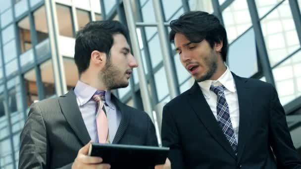 Businesspeople going at work and using tablet and smartphone — Stock Video