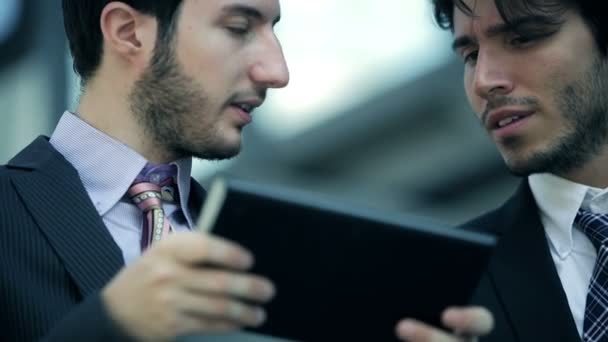 Businesspeople at work with tablet and smartphone — Stock Video