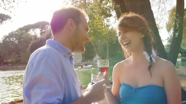 Young lovers drinking red wine — Stock Video