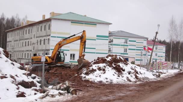 Excavator on a construction site — Stock Video