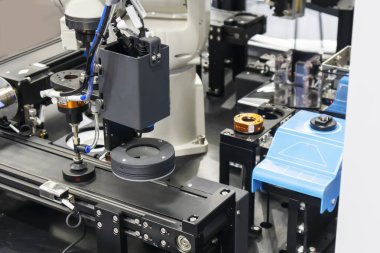 Robotic arms in large industrial production systems and robotic management systems