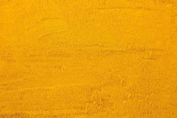 Turmeric powder background — Stock Photo, Image