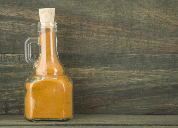 Turmeric powder in the jar. — Stock Photo, Image