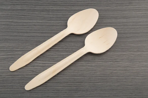 Two wooden spoons on wooden background — Stock Photo, Image